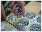 Filling muffin tins with metal shavings